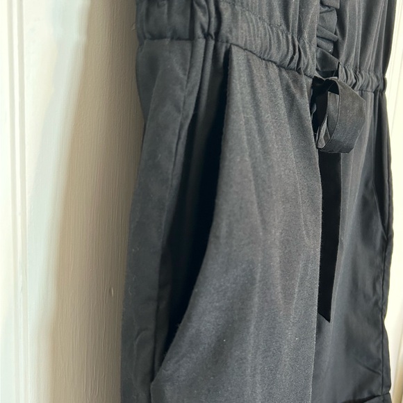 Black Ruffle Button-Up Romper - Picture 7 of 9